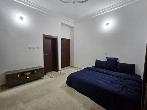a bedroom with a bed and a dresser in it at The Nest in Aso