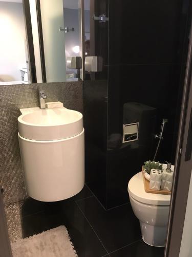 a bathroom with a sink and a toilet at Thong Lor condo Next to BTS in Bangkok