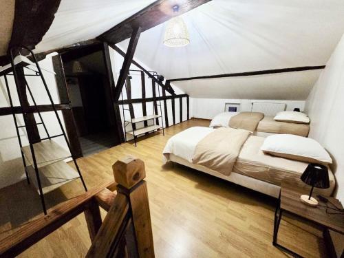 a bedroom with two beds in a attic at Bohéme Chic in Saint-Dizier