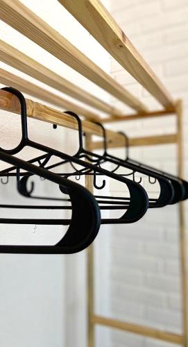 a pair of towels hanging from a rack at Casa Freitas - Suíte 2 in Extrema