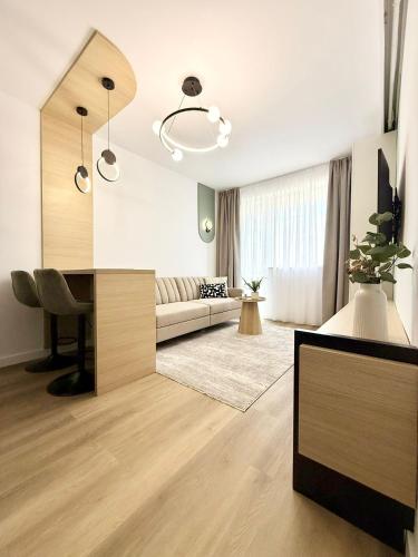 a living room with a couch and a table at Central View Apartment in Timişoara