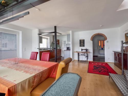 a kitchen and dining room with a table and chairs at Ferienhaus Pippan in Velden am Wörthersee
