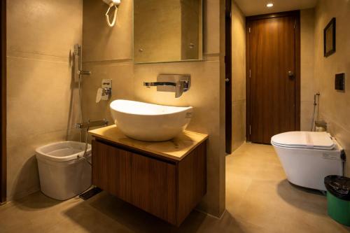 a bathroom with a sink and a toilet at Hotel Rs Vista - Agra in Agra