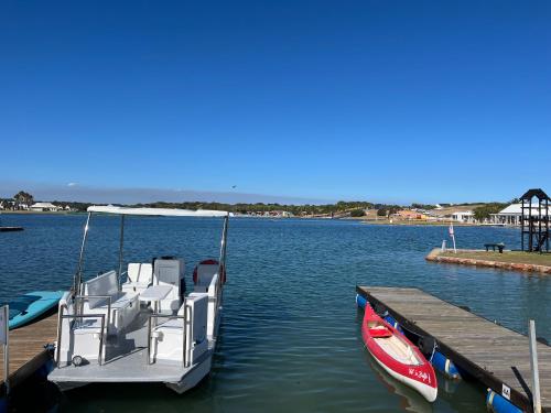 a boat is docked at a dock in the water at Marina stunning escape in Jeffreys Bay