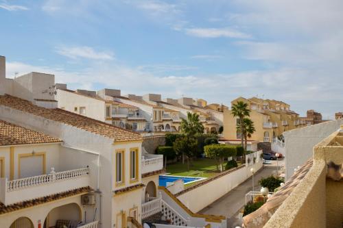 a view from the balcony of a town with houses at Casa Jema - Family house with ocean views in Gran Alacant