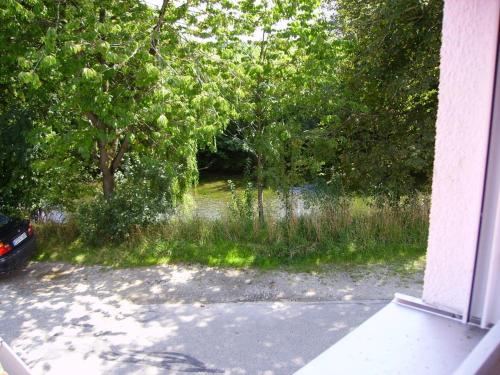 a view of a river from the window of a house at Wiflinger Graben Einfamilienhaus in Wörth