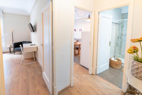 a hallway with a mirror and a desk in a room at Hotel Celta in Vigo