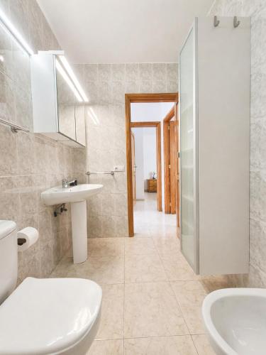 a bathroom with a sink and a toilet at Casa Donna in Playa Honda