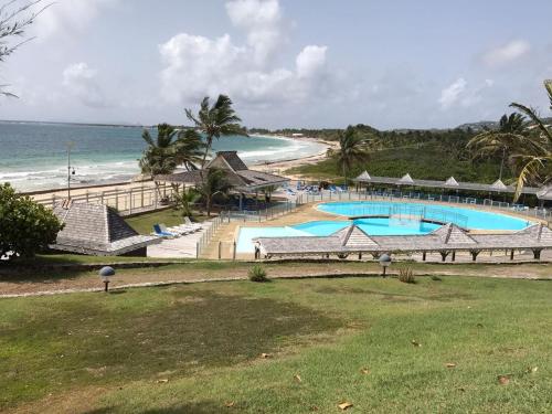 an aerial view of a resort with a beach at St Martin Collections in Cul de Sac