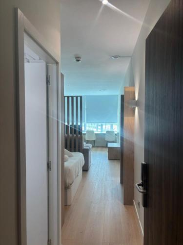 a view of a room with a bed and a living room at Aravaca Palm in Madrid