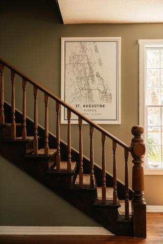 a picture of a stairway in a house with a stair railing at At Journey's End in St. Augustine