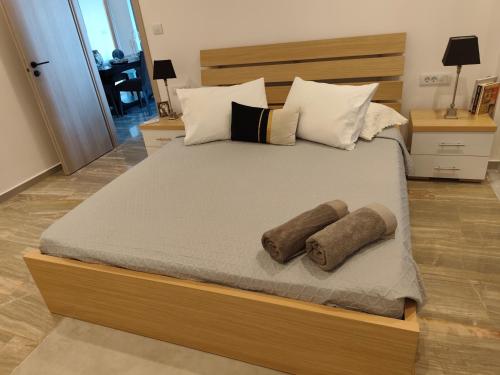 a large bed with two pillows on it at Sunrise House in Kefalos