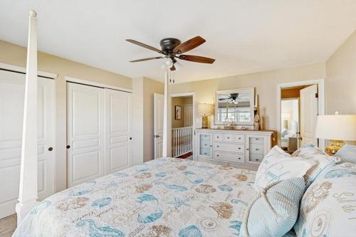 a bedroom with a bed and a ceiling fan at Sunset Village 31E in Ocean City