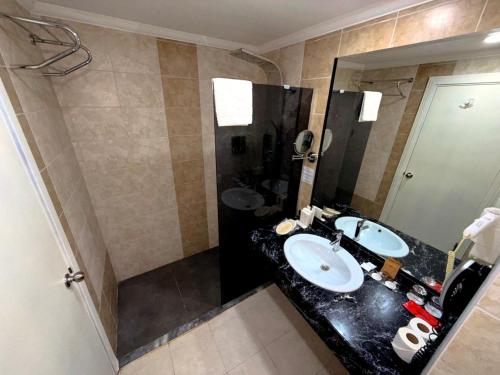 a bathroom with two sinks and a large mirror at Casa Fora Beach Resort Hotel - Spa & Aqua park - All Inclusive Plus Concept in Belek