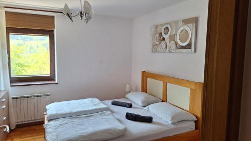 a bedroom with two beds in a room at Apartmaji Grapa in Most na Soči