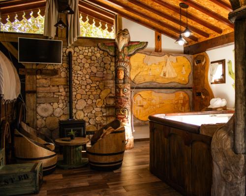 a room with a bath tub and a room with a bath tub at Posada la Leyenda in Santillana del Mar
