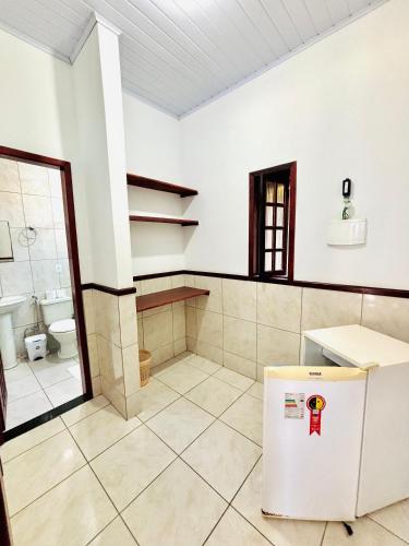 a bathroom with a sink and a toilet in a room at Pousada H&D in Angra dos Reis