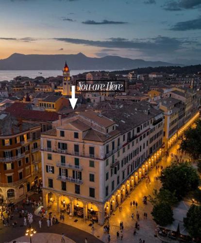 a building with a sign that says you are here at Veneziana Liston view apt in Corfu