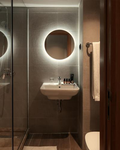 a bathroom with a sink and a glass shower at MIA Urban Detroit Tanger in Tangier