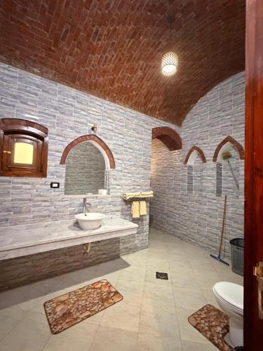 a bathroom with a sink and a toilet at Oriental house in Luxor