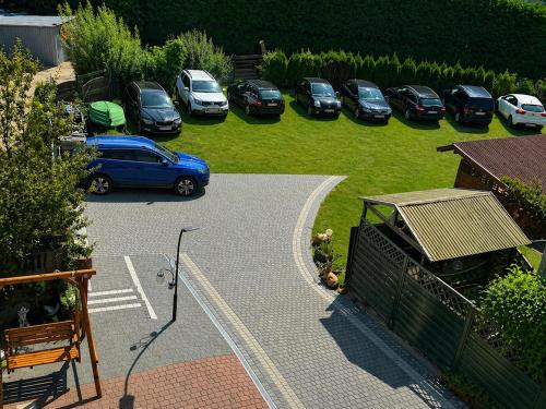a bunch of cars parked in a parking lot at Pensjonat Semida in Władysławowo