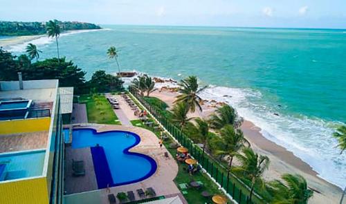 an aerial view of a beach and the ocean at Flat Premium Sea View - Tabatinga Beach in Conde