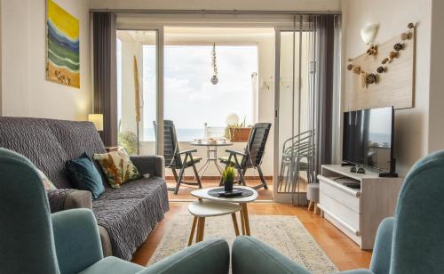 a living room with a couch and a table at B65 - Casa Le Ferreira in Praia da Luz in Luz