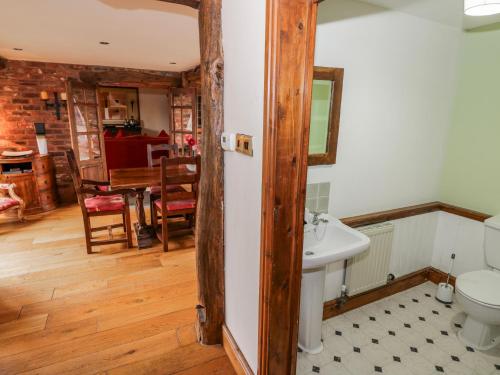 a bathroom with a sink and a toilet in a room at The Haybarn in Lichfield