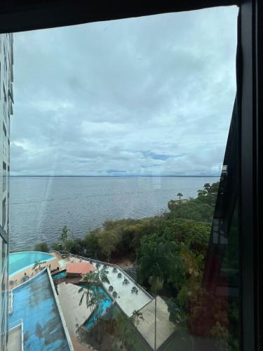 a view of the ocean from a hotel window at Tropical Executive Vista Pôr do Sol in Manaus