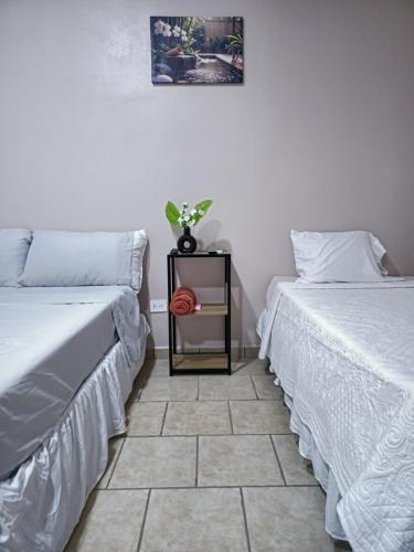 two beds sitting next to each other in a room at Rivera Solea in Llano de Los Patos