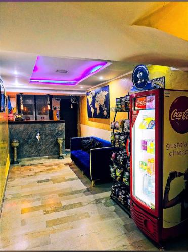 a room with a soda machine and a bar at Ali City Hotel tunis in Tunis