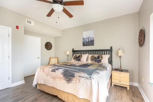a bedroom with a bed and a ceiling fan at Mountain View Condo 1306 in Pigeon Forge