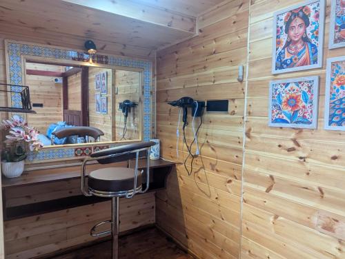a bathroom with a sink and a mirror at Cloudwalks Homestay in Kodaikānāl