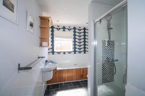 a bathroom with a shower and a sink at 50 Harbour Road in Bognor Regis