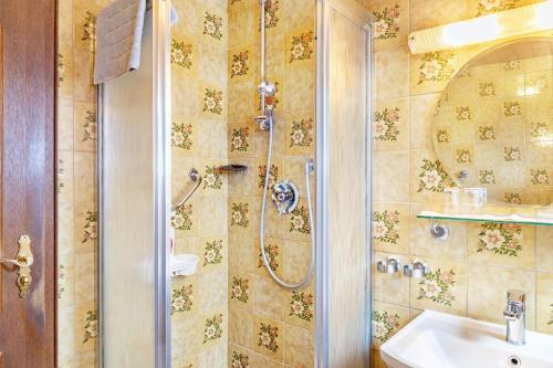 a bathroom with a shower and a sink at Ferienwohnung Parterre in Wallgau