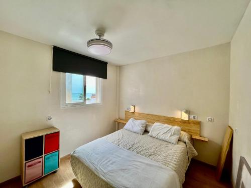 a bedroom with a bed and a television in it at Vera Naked in Vera