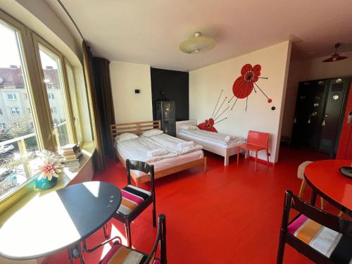 a living room with a bed and a table at Lalala in Sopot