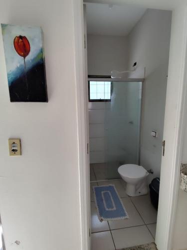a bathroom with a shower and a toilet in it at Aconchego 3 - Self Check-in in Presidente Prudente
