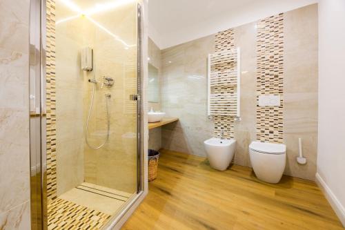 a bathroom with a shower and a toilet and a sink at Mare e Monti in Genoa