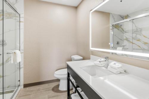 a bathroom with a sink and a toilet at Studio 6 Tempe, AZ Elliot Road in Tempe