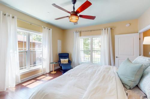 a bedroom with a bed and a ceiling fan at Anchors Aweigh in Edgewater