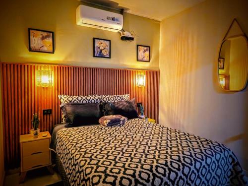 a bedroom with a large bed in a room at Quincho's Place in Santa Ana