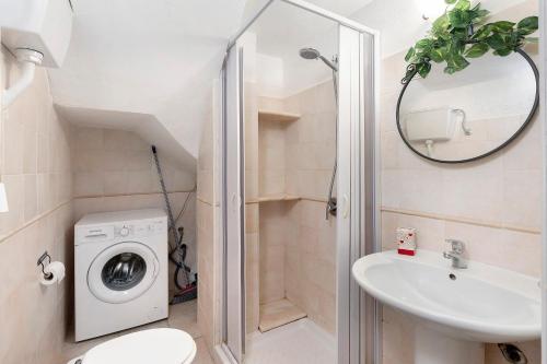 a bathroom with a shower and a toilet and a sink at Casa Sciura in San Vito lo Capo