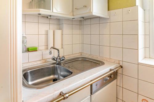 a kitchen with a stainless steel sink in a room at Haus Schmucker in Hohekreuz