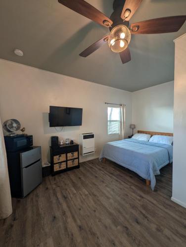 a bedroom with a bed and a ceiling fan at Cozy Cabin in Squaw Valley