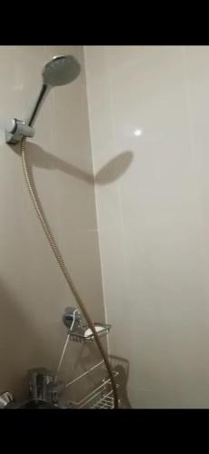 a lamp on a wall in a bathroom at Manhattan Heights TowerD-Unit5 Viv's room Studio type in Manila
