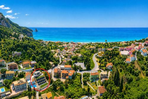 an aerial view of a town next to the ocean at Nobile Boutique Hotel in Agios Gordios