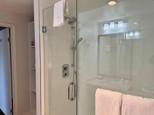 a bathroom with a shower with a glass door at Sherwood Inn in Port Carling