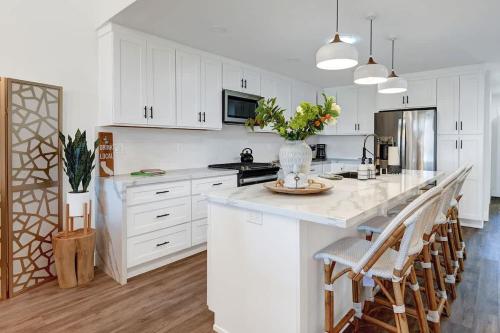 a kitchen with white cabinets and a white counter top at Courtyard-Patio-Moutain and V3872-Holly House in Palm Desert