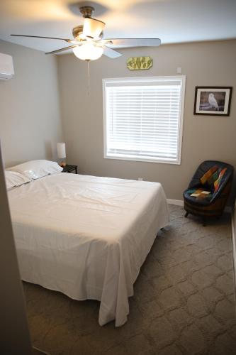 a bedroom with a bed and a ceiling fan at Retreat on First Street in Prescott